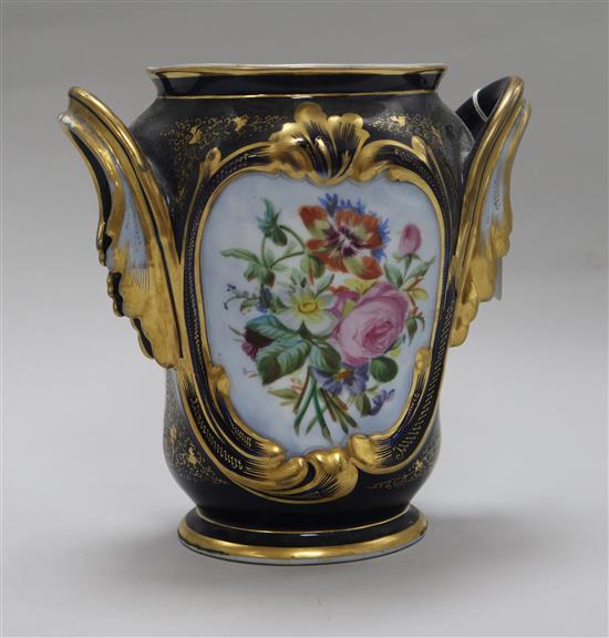 A late 19th century French porcelain two handled vase, on cast gilt metal base